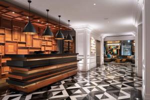 a lobby with a black and white checkered floor at Courtyard by Marriott San Francisco Downtown/Van Ness Ave in San Francisco