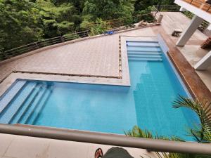 an overhead view of a swimming pool on top of a building at Eco Hotel Villa Suites in Quillabamba