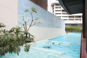 Bazén v ubytování Pan Pacific Serviced Suites Orchard, Singapore nebo v jeho okolí