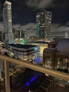 a city skyline at night with tall buildings at Opulence is a way of life in Dallas