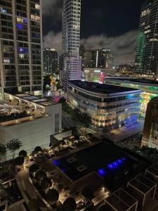a view of a city at night with buildings at Opulence is a way of life in Dallas
