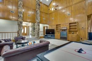 a large living room with a pool table in it at Texas Ranch Vacation Rental with Outdoor Pool! in Commerce