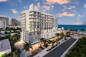 an aerial view of a hotel on the beach at AC Hotel by Marriott Fort Lauderdale Beach in Fort Lauderdale