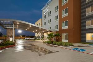 an empty parking lot in front of a hotel at Fairfield Inn by Marriott Houston Northwest/Willowbrook in Houston