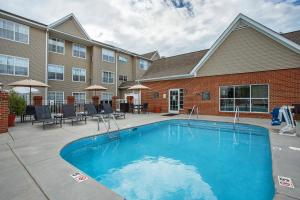 a swimming pool in front of a building at Residence Inn Knoxville Cedar Bluff in Knoxville