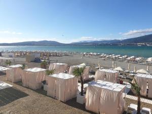 a group of white tents on a beach at Luxury Apartment on Krymskaya 22 in Gelendzhik