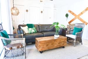 a living room with a leather couch and chairs at Emerald Hideaway condo in Navarre