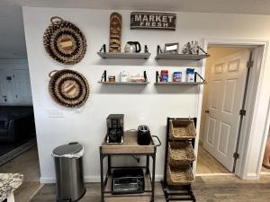 a room with a table and shelves on the wall at Emerald Hideaway condo in Navarre