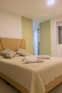 Ένα ή περισσότερα κρεβάτια σε δωμάτιο στο Ventiuna Hotel y Coliving