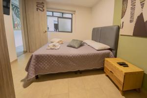 Ένα ή περισσότερα κρεβάτια σε δωμάτιο στο Ventiuna Hotel y Coliving