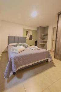 Ένα ή περισσότερα κρεβάτια σε δωμάτιο στο Ventiuna Hotel y Coliving