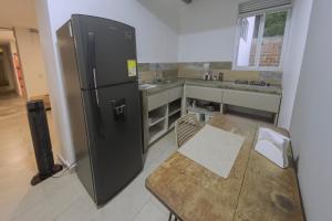 Η κουζίνα ή μικρή κουζίνα στο Ventiuna Hotel y Coliving