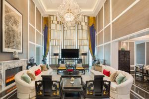 a living room with two couches and a chandelier at The St Regis Shanghai Jingan - Where Downtown Luxury Meets Legendary Old Shanghai Jazz in Shanghai