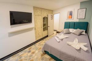 Ένα ή περισσότερα κρεβάτια σε δωμάτιο στο Ventiuna Hotel y Coliving