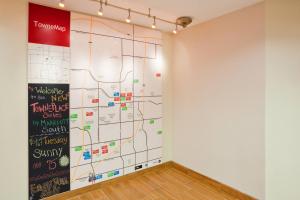 a large wall mural in a room with a map at TownePlace Suites by Marriott Sioux Falls South in Sioux Falls