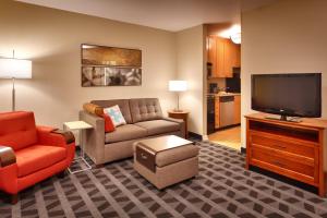 a living room with a couch and a television at TownePlace Suites by Marriott Sierra Vista in Sierra Vista