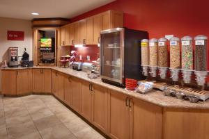 a large kitchen with wooden cabinets and a counter top at TownePlace Suites by Marriott Sierra Vista in Sierra Vista