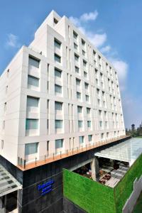 a rendering of a hotel building with a pool at Fairfield by Marriott Kathmandu in Kathmandu