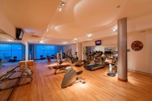 a gym with a bunch of exercise equipment in it at Courtyard by Marriott Venice Airport in Tessera