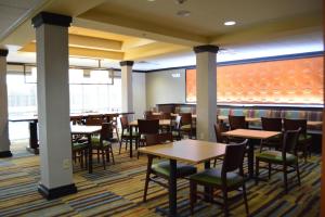 a dining room with tables and chairs at Fairfield Inn & Suites Houston Channelview in Channelview