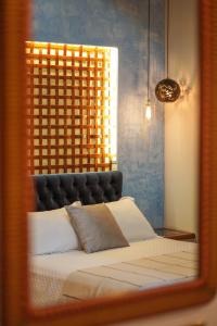 a reflection of a bed in a mirror at Hotel Casa Vertiz in Oaxaca City