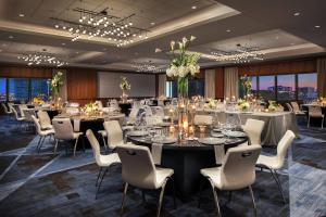 a large banquet room with tables and chairs at Le Meridien Houston Downtown in Houston