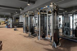 a row of tread machines in a gym at Courtyard Pasco Tri-Cities Airport in Pasco