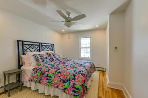 a bedroom with a bed and a ceiling fan at Brigantine Waterfront Vacation Rental with Grill in Brigantine