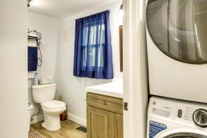 a bathroom with a toilet and a washing machine at Peaceful Country Home in Serene Setting with Yard in Washington +26 photos