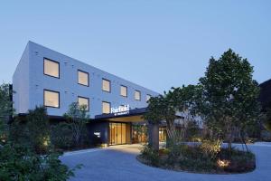 a large building with a lot of windows at Fairfield by Marriott Tochigi Nikko in Nikko