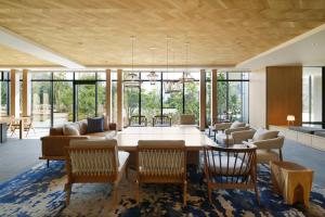 a living room with a table and chairs at Fairfield by Marriott Tochigi Nikko in Nikko