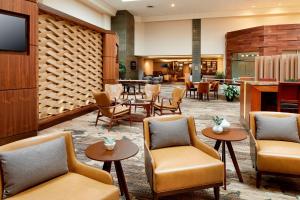 a lobby of a hotel with chairs and tables at Marriott Columbus Northwest in Dublin