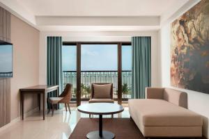 a living room with a couch and a table at Fairfield by Marriott Belitung in Tanjungpandan