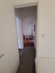 a hallway leading to a dining room with a table at Todo cerca en San Isidro in San Isidro