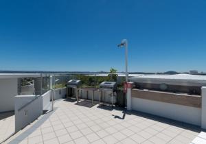 a balcony of a building with a view of the ocean at Resort Apartment with Ocean Views in Maroochydore