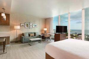 a hotel room with a bed and a television at Residence Inn by Marriott Panama City in Panama City