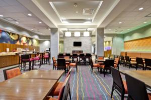 a large dining room with tables and chairs at Fairfield Inn & Suites by Marriott Guelph in Guelph
