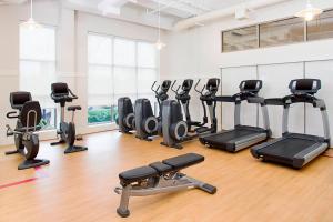 a gym with several treadmills and exercise bikes at Sheraton Rockville in Rockville
