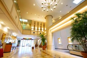 a lobby of a building with a chandelier at Sasebo Washington Hotel in Sasebo