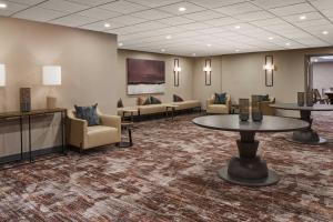 a lobby with a waiting room with couches and tables at The Westin Tysons Corner in Tysons Corner