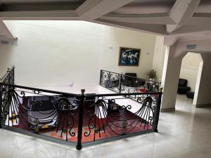 a living room with a wrought iron railing at Hotel Bosque Chapinero in Bogotá