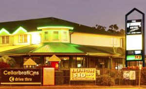 a restaurant with a sign on the front of it at Meadowbrook Hotel Brisbane in Loganlea