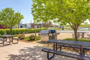 a group of picnic tables and a grill in a park at Waterfront Sandusky Vacation Rental Downtown! in Sandusky