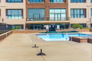 an empty swimming pool in front of a building at Waterfront Sandusky Vacation Rental Downtown! in Sandusky