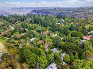 an aerial view of a town with trees at Leura Country Cottage in Leura