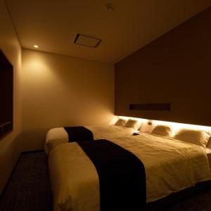 Un pat sau paturi într-o cameră la みくに隠居処