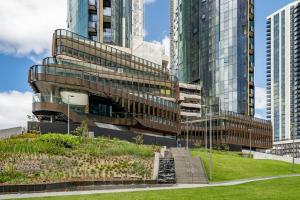 a building with stairs in front of tall buildings at City View Luxury 3 Bedroom Apartment-Free Car Park in Melbourne