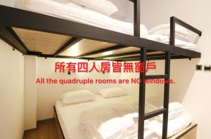 Postel nebo postele na pokoji v ubytování Taipei Sunny Hostel