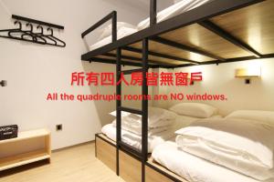 Postel nebo postele na pokoji v ubytování Taipei Sunny Hostel