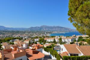 a view of a town with houses and a lake at Villa Alegria by NRAS in Albir